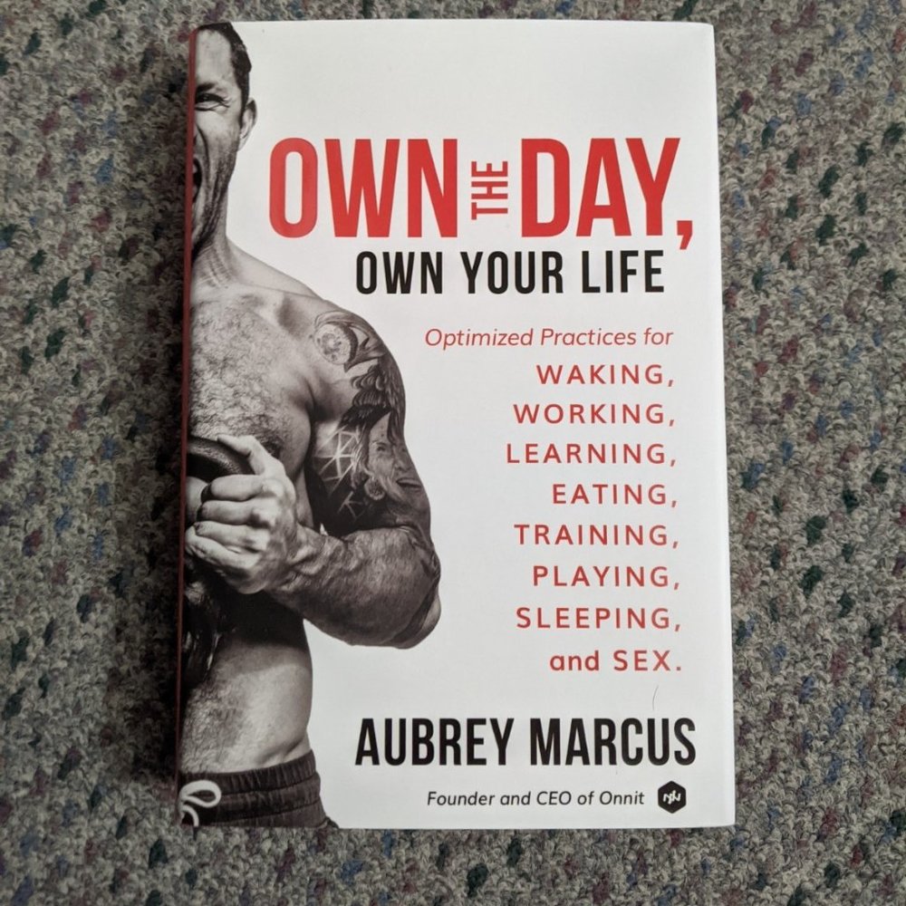 Hardcover Own The Day, Own Your Life by Aubrey Marcus